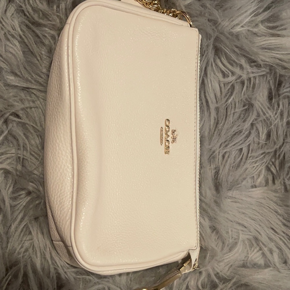 Off white Coach wristlet, brand new